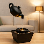 Zen Teapot Water Fountain with LED Warm Light & Flowing Water | Black Resin Tabletop Relaxation Fountain, Pebble Bed, Meditation Decor for Home Office, Stress Relief Gift